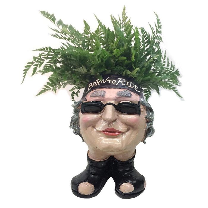 A ceramic planter shaped like a smiling person with sunglasses, wearing a hat that reads 
