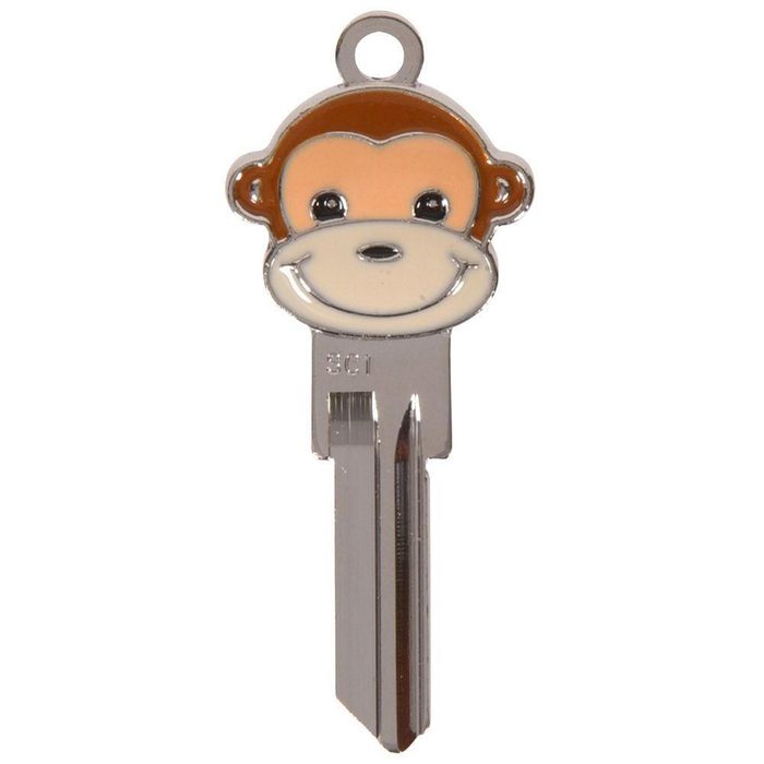 A monkey-shaped key features a smiling face design. It is metallic and shiny, designed for unlocking doors or other devices.