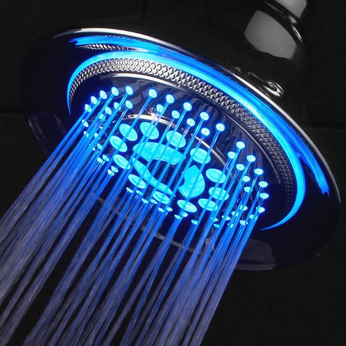 A showerhead emits blue-lit water streams, creating an illuminated cascading effect against a dark background, enhancing the shower experience.