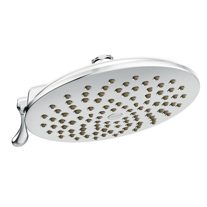 A round showerhead with numerous small nozzles is mounted from the wall, typically used for bathing in a bathroom setting.