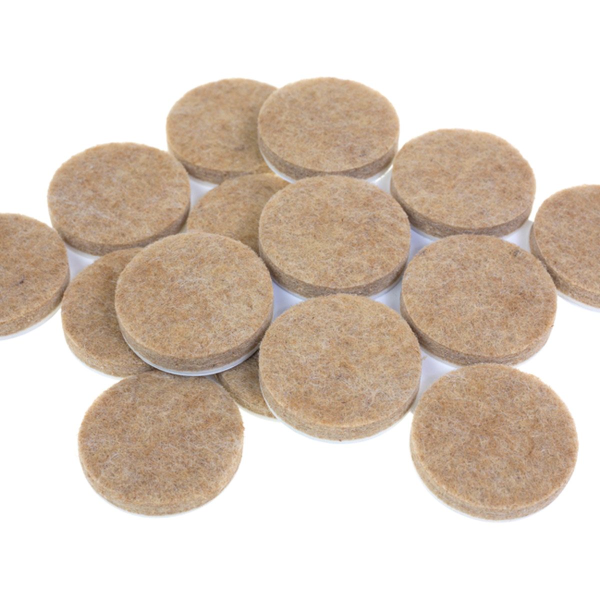 Circular felt pads are arranged haphazardly, showcasing their soft, brown surfaces. They serve as protective coasters or furniture feet in a bright, clean environment.