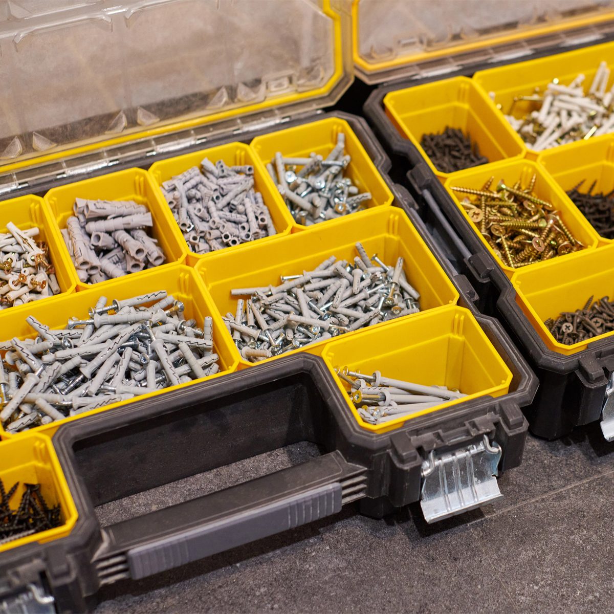 Gettyimages 1350037980 Storage Boxes On Floor With Screws, Nuts, Bolts, Nails And Other Small Tools For Handyman Credit Travelarium