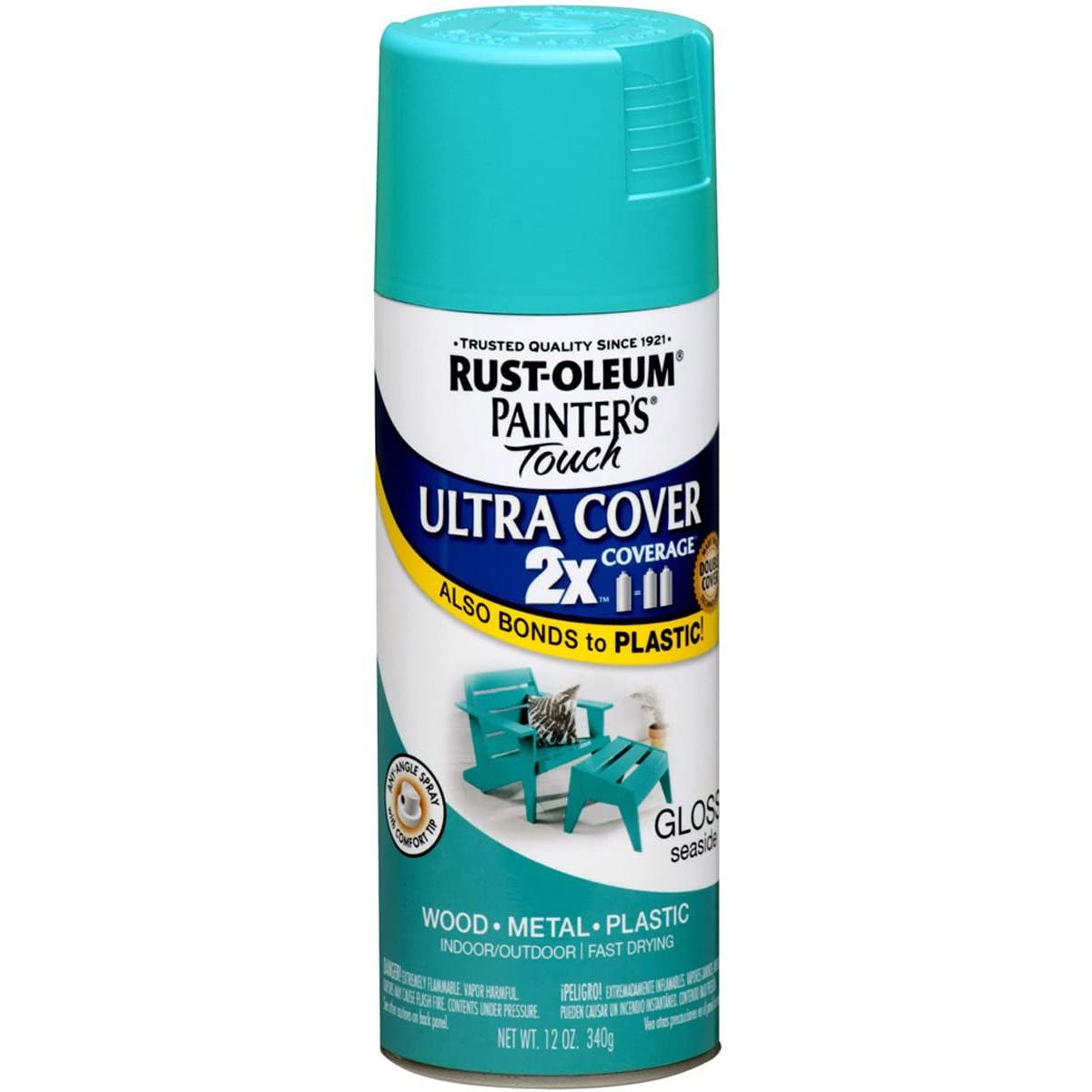 A spray can of turquoise paint sits upright, labeled for use on wood, metal, and plastic, with a coastal-themed image of outdoor chairs.