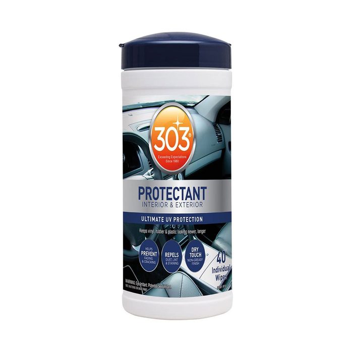 A cylindrical container holds automotive protectant wipes, labeled for interior and exterior use, emphasizing UV protection and a non-greasy finish, with 40 individual wipes inside.
