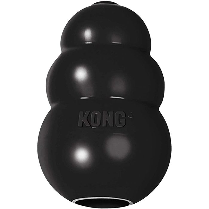 A black rubber toy shaped like a snowman is upright, designed for dogs to chew and play, often filled with treats for engagement.