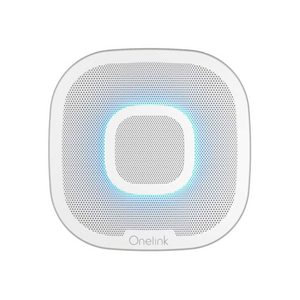 A square speaker emits light blue illumination, surrounded by a perforated surface, designed for sound output in a modern audio environment.