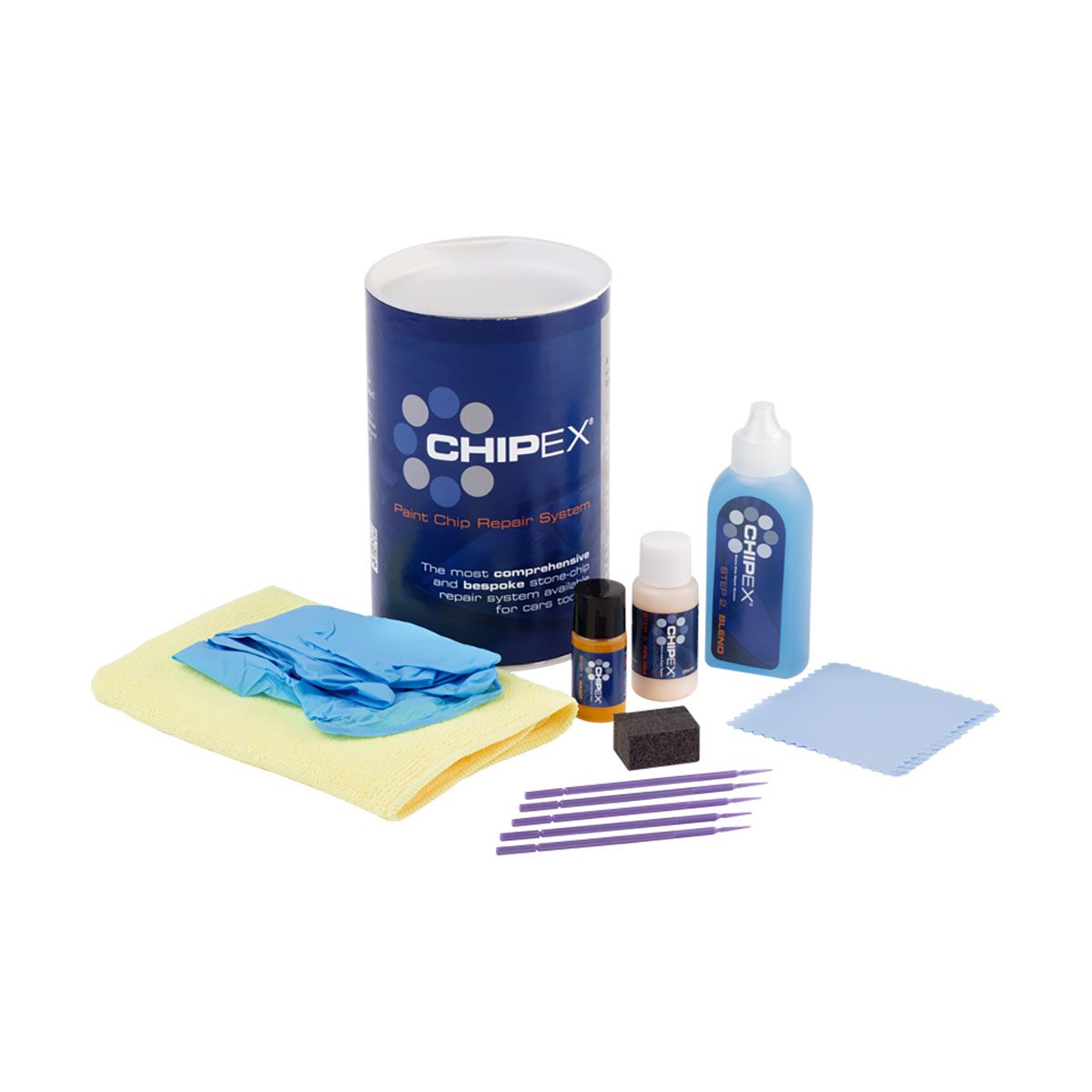 A paint chip repair kit includes a canister, cleaning cloth, gloves, and various solution bottles arranged neatly for automotive use.