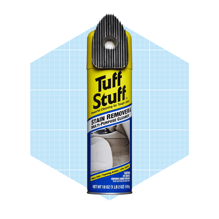 A yellow aerosol can labeled 
