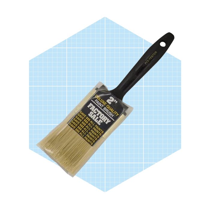 A 2-inch paint brush is displayed, its bristles are packaged, indicating it's for use with various paints, against a light blue grid background.