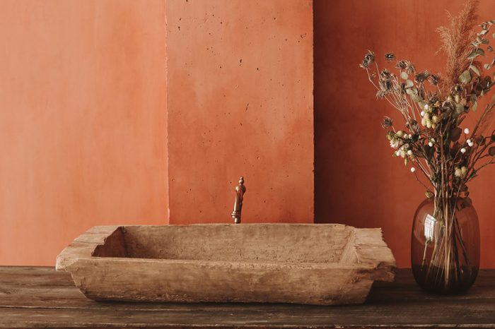 Minimalistic Interior Style. Dry Flowers In A Glass Vase Standing On A Wooden Shelf, Vintage Sink