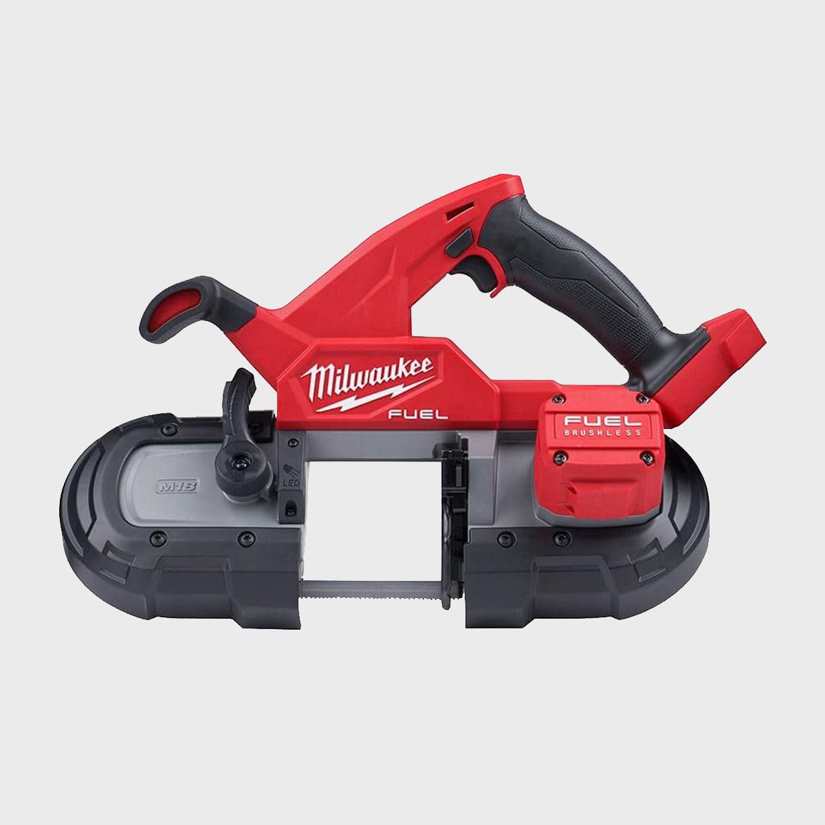 A red and gray cordless band saw powers through materials silently on a workbench, featuring a prominent handle and battery pack for mobility and convenience.