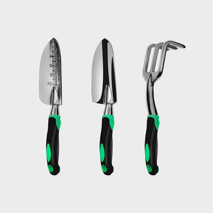 Three gardening tools, including a trowel, a spade, and a cultivator, are displayed on a plain background, showcasing their shiny metal heads and green-accented handles.