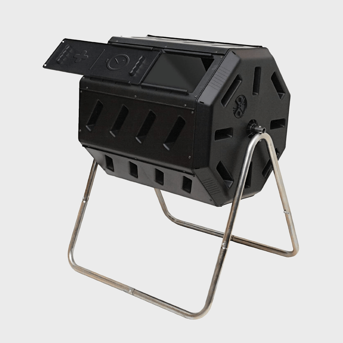 A black compost tumbler stands on a metal frame, with an open lid revealing a compartment for compost materials, designed for efficient waste decomposition.