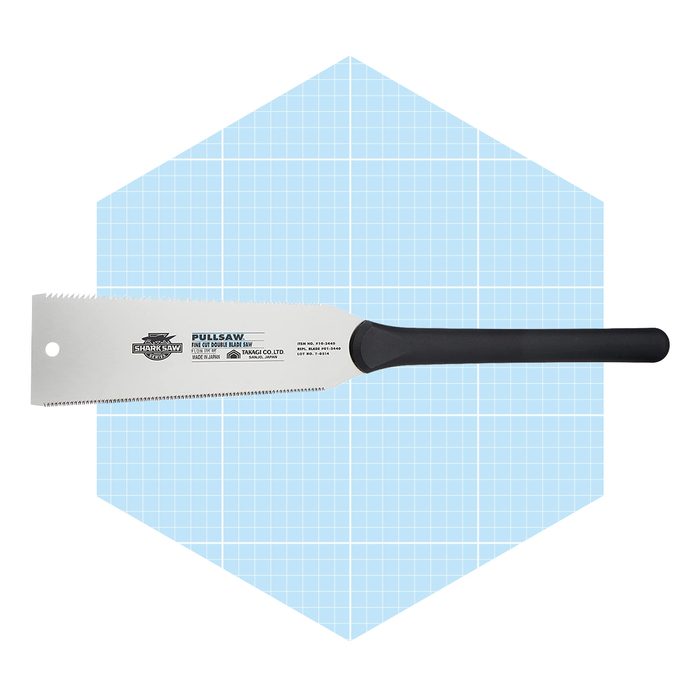 A hand saw with a serrated edge rests against a light blue, grid-patterned background, designed for cutting through materials efficiently.
