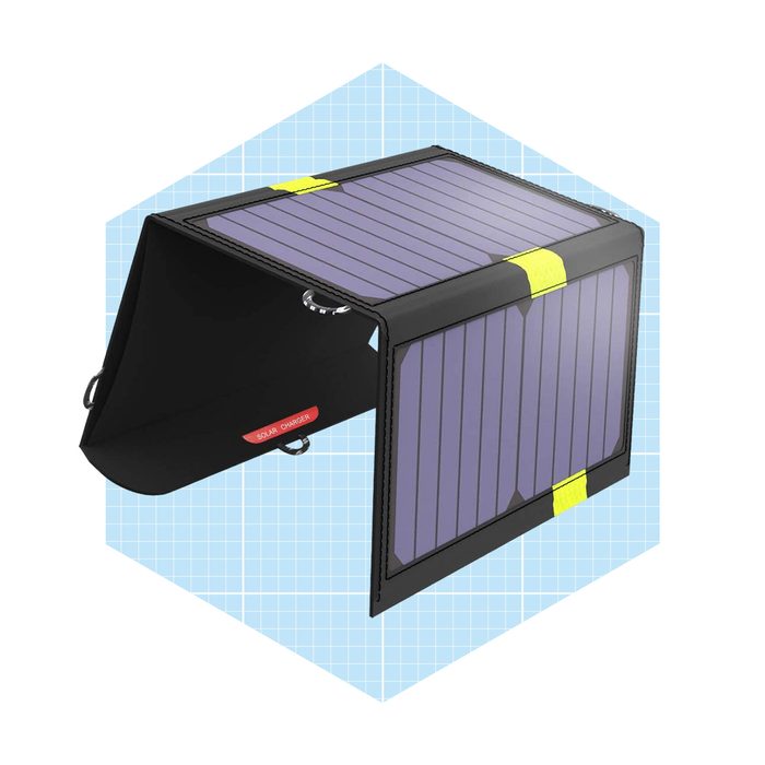 A solar charger is positioned upright, capturing sunlight. It features a foldable design with purple solar panels and a black exterior, set against a light blue background.