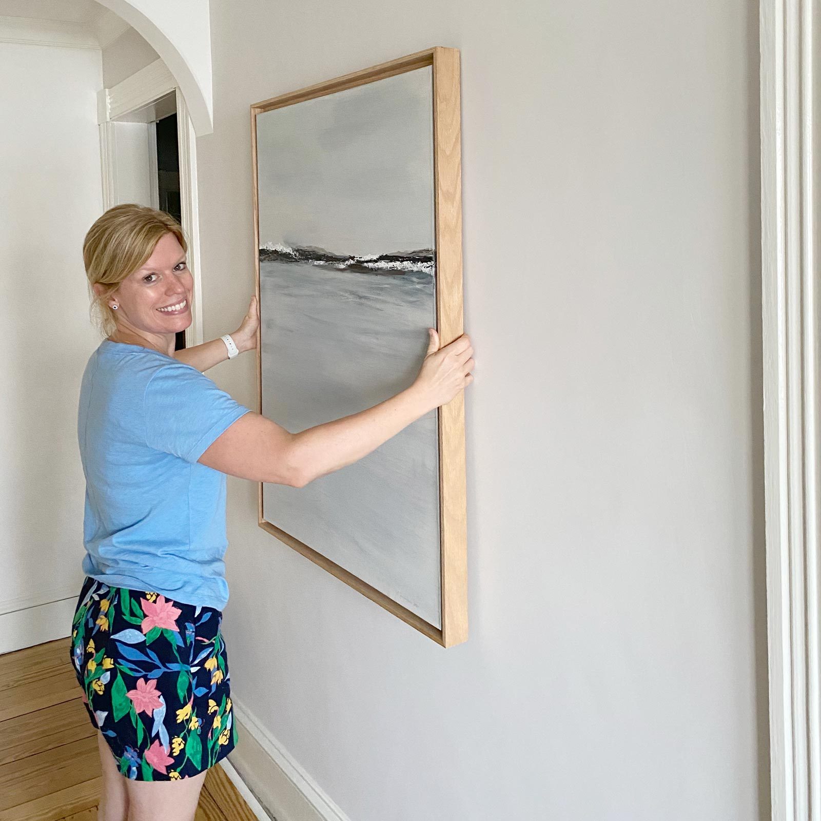 hanging picture on plaster wall